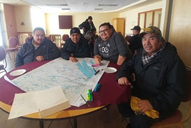 Cree Tallymen from the community of Mistissini map cultural features to help develop proposals for protected areas of significance to the Crees and the Cree way of life (Photo by NCC)