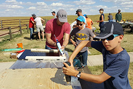 Building bat boxes at Old Man on His Back Prairie and Heritage Conservation Area, SK (Photo by NCC)