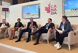 Rob Wilson and other panelists at the Grasslands and Canadian Livestock: Solutions from the Ground Up event at COP28 (Photo by Melanie Bos/NCC)