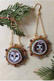 Owls (barn owl and spotted owl) (Beadwork by Raechel Wastesicoot/NCC staff)