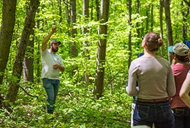 Brett Norman, conservation biology coordinator for Norfolk Forests and Long Point Wetlands, giving a tour of Backus Woods (Photo by NCC)