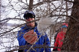 Brian Keating examines feathers found on the hike (Photo by NCC)