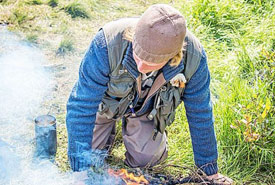 Colin Preston tending his fire. (Photo by Paul Smith//Special to The Telegram)