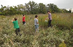 Children from Pelee Island Public School help collect seeds for restoration projects. (Photo by NCC)