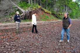 Danielle Horne (NCC), Jamie Fraser (NCC) and John Caraberis on the brick beach, NS (Photo by NCC)