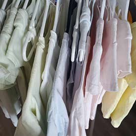 A rack of shirts dyed with natural colouring. (Photo by Sage Yathon)