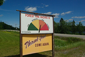 Will forest fire hazard signs be over into the red more often because of climate change? (Photo by Aaron H Warren CC BY-ND 2.0)