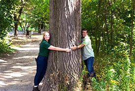 Anwar Knight and I hugging a black oak tree in High Park.  (Photo courtesy of Anwar Knight)