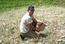 Conservation Intern Levi Williams Whitney cleaning up an NCC site (Photo by NCC)