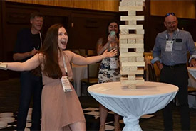 Megan Quinn celebrates a moment of success during a game of Jenga (Photo courtesy of SFI)