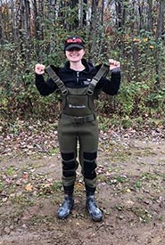 Megan Quinn wearing hip waders to stay dry while working in the Alfred Bog. (Photo by NCC)