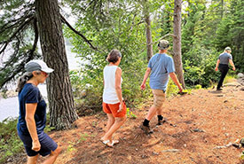 NCC staff lead a hike to Mosquito Point on Town Island. (Photo by Mirabai Alexander/NCC staff)