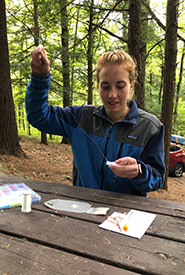 Beading outdoors is where I'm most at peace. Here, I'm beading while camping at Bon Echo Provincial Park, Ontario. (Photo by Chase Wastesicoot)
