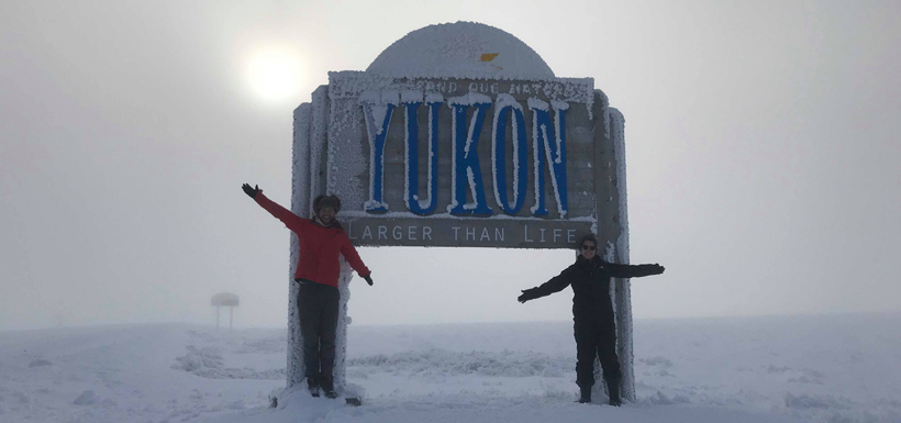 Rachel and I in front of the Yukon welcome sign (Photo by NCC)