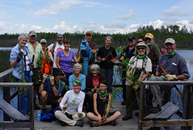 Conservation Volunteers with thistles as props (Photo by NCC)