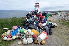 Conservation Volunteers with the marine debris that they removed from the Boar’s Head Nature Reserve, Nova Scotia (Photo by NCC).