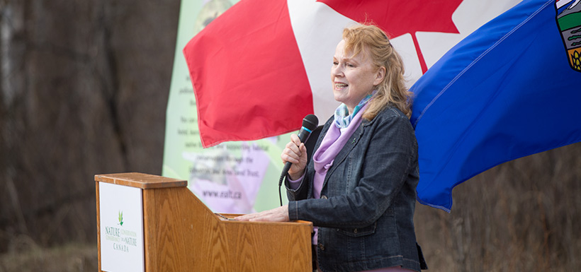 Pam Wight at the podium during the Bunchberry Meadows event (Photo by Brent Calver)