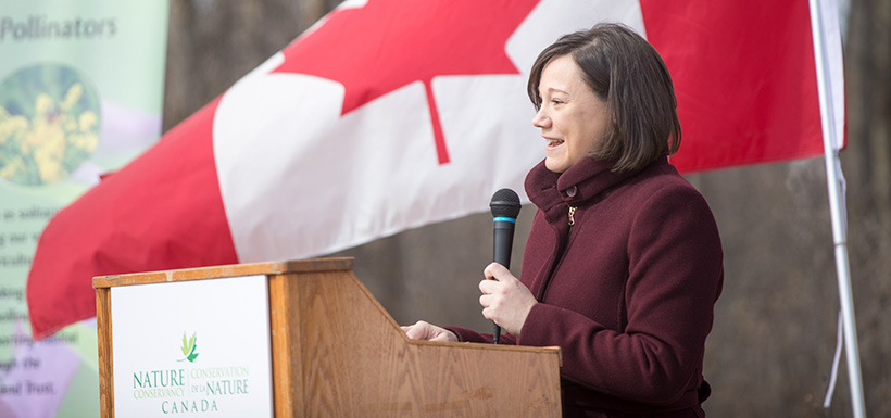 Shannon Phillips at the podium during the Bunchberry Meadows event (Photo by Brent Calver)