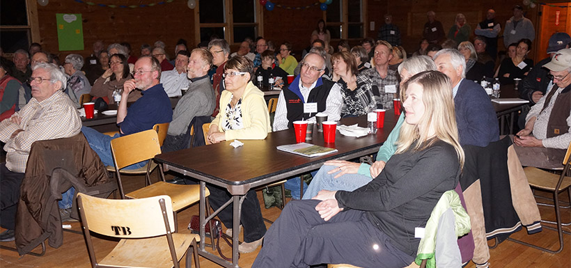 Crowd of nearly 100 people watching the presenters at the Waterton Eat and Greet (Photo by NCC)