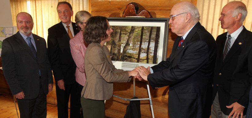 Paula Noel shaking hands with land donor Derek Burney, Chignecto Isthmus announcement, Moncton, NB (Photo by Mike Dembeck)