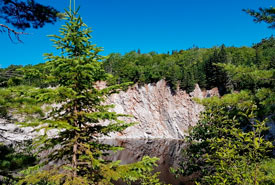 The steep gypsum cliffs, lake and mature forest that served as a great view during lunch. (Photo by NCC) 