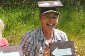 Volunteer Denise Harris shows the way with trail signs at a CV event (Photo by NCC)