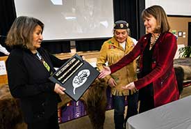 Nancy Newhouse, BC regional vice-president, receiving thank you plaque from Ktunaxa Nation Council chairperson Kathryn Teneese at Jumbo Valley celebration (Photo by Pat Morrow)