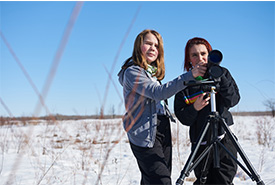 Girls with telescope. Tall Grass Prairie. Photo by D. Lipnowski